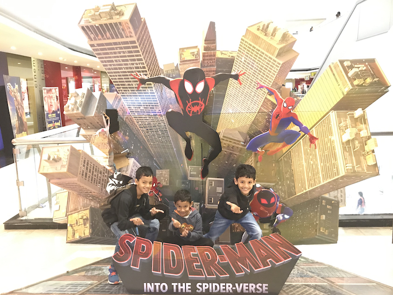 The iThree play their parts at the Spiderman into the Spiderverse installation