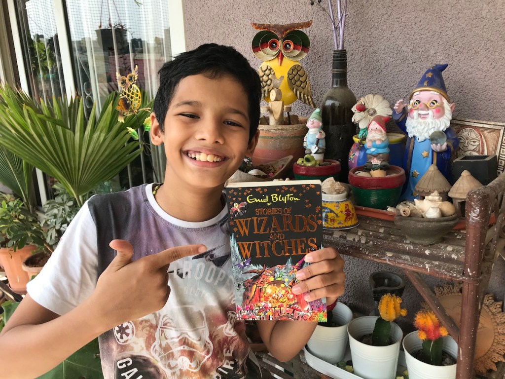 Inesh Shenoy of i3andCo showing off his copy of Stories of Wizards & Witches